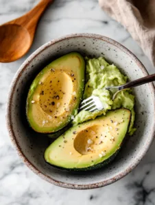 Season the mashed avocado with salt, pepper, and a squeeze of lemon juice (optional). Spread evenly over the toasted bread