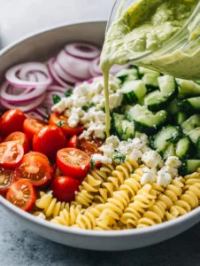 In a blender or food processor, blend avocado, olive oil, lemon juice, garlic, salt, and pepper until smooth and creamy.
